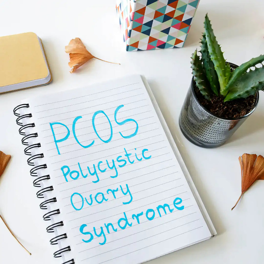 PCOS word written in the notebook