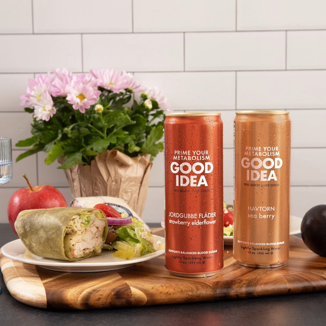 two GOOD IDEA cans with a wrap on a kitchen table
