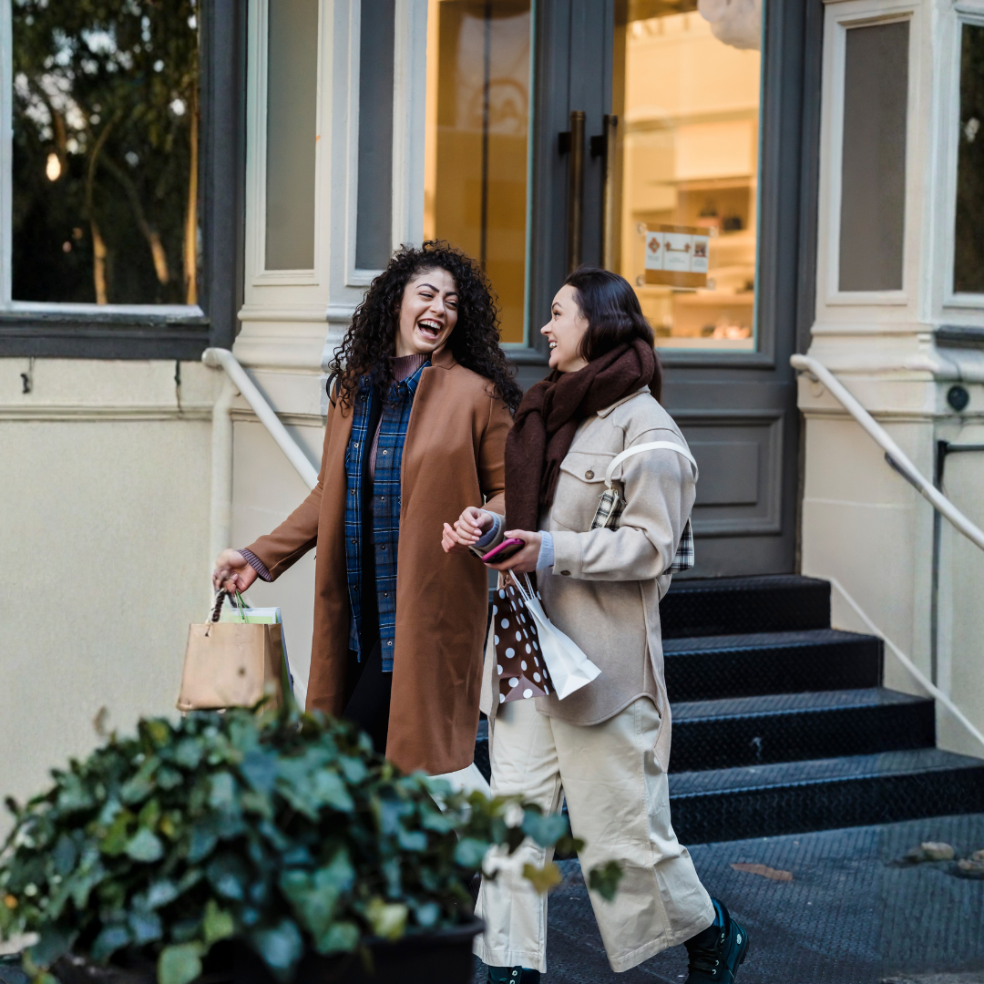 two women walking downtown