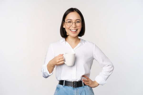 woman-smiling-holding-glass-tea