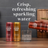 Person pouring a can of Good Idea sparkling water into a glass on a kitchen counter, with text on the image that reads “crisp, refreshing sparkling water.”
