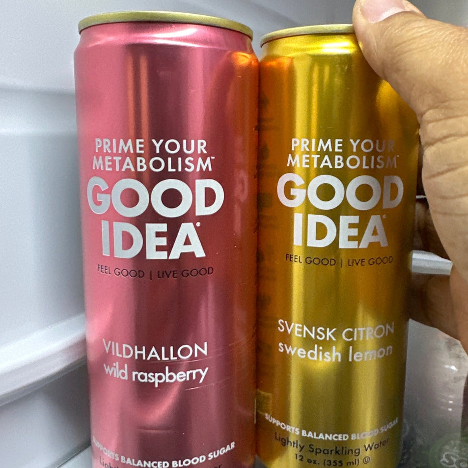 Two GOOD IDEA drinks in the refrigerator. Person grabbing one can. Photo from customer.