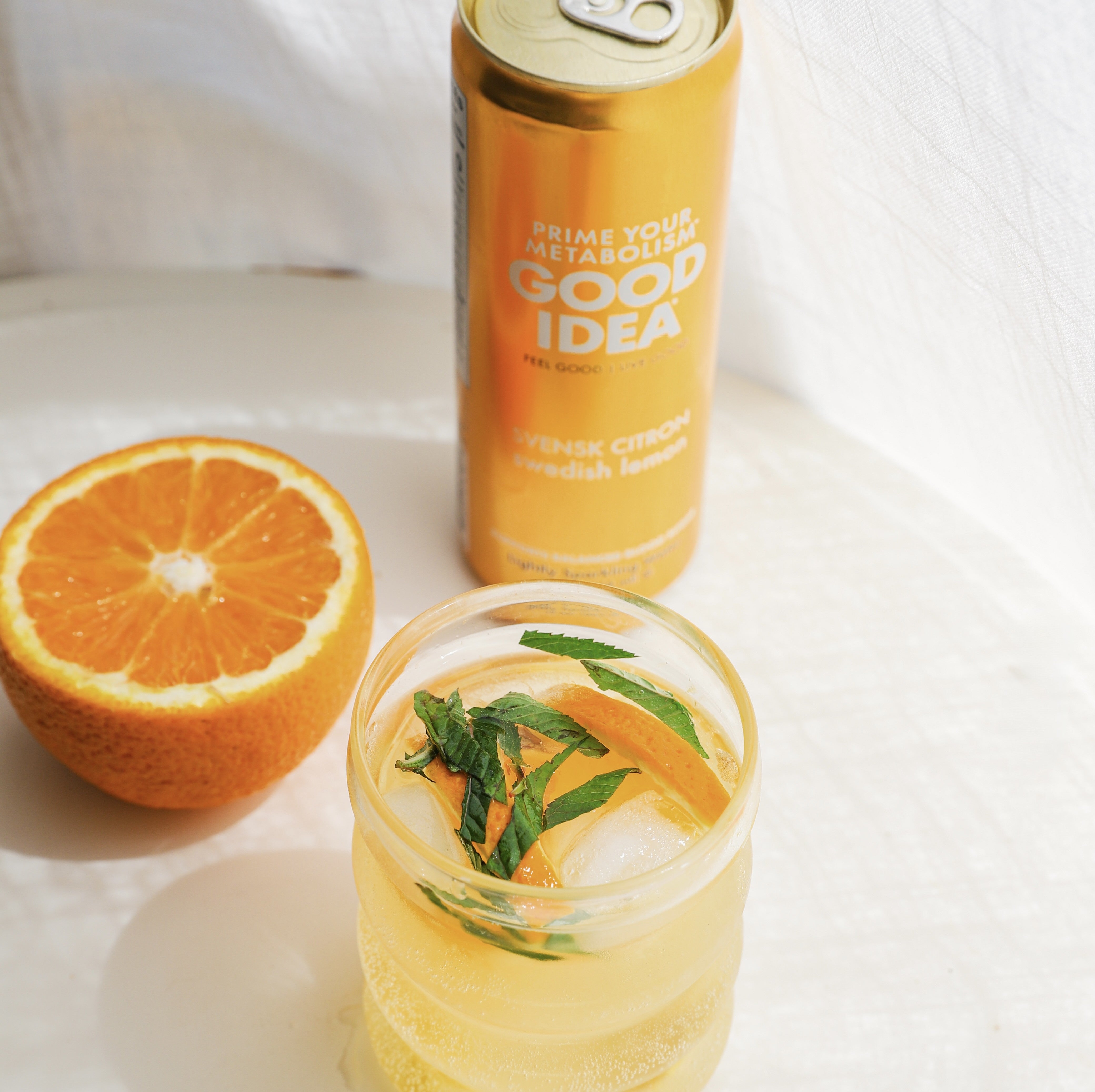 GOOD IDEA lemon with an orange in the background