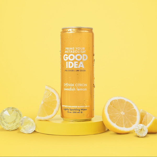 Can of Good Idea Swedish Lemon sparkling water with lemon slices on a yellow background
